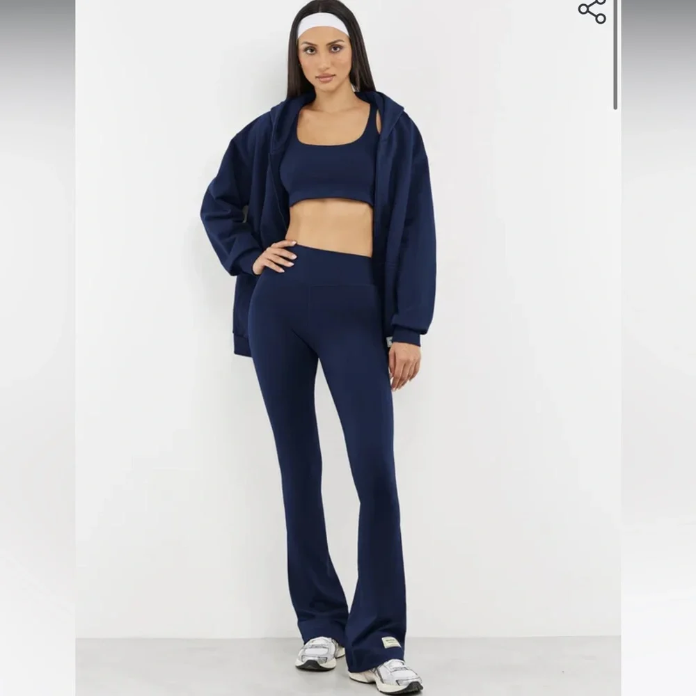 The Giving Movement Ribbed Flared Leggings in Navy - Picture 2 of 7